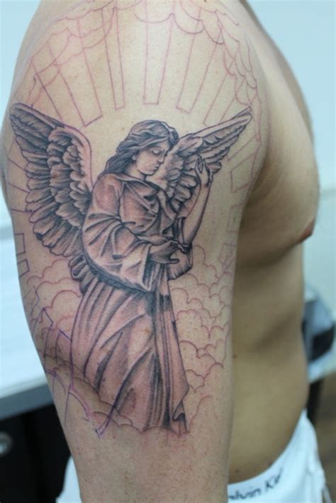 angel with flowers tattoo|117 Angel Tattoo Ideas: A Heavenly Guide to Your Next Ink.